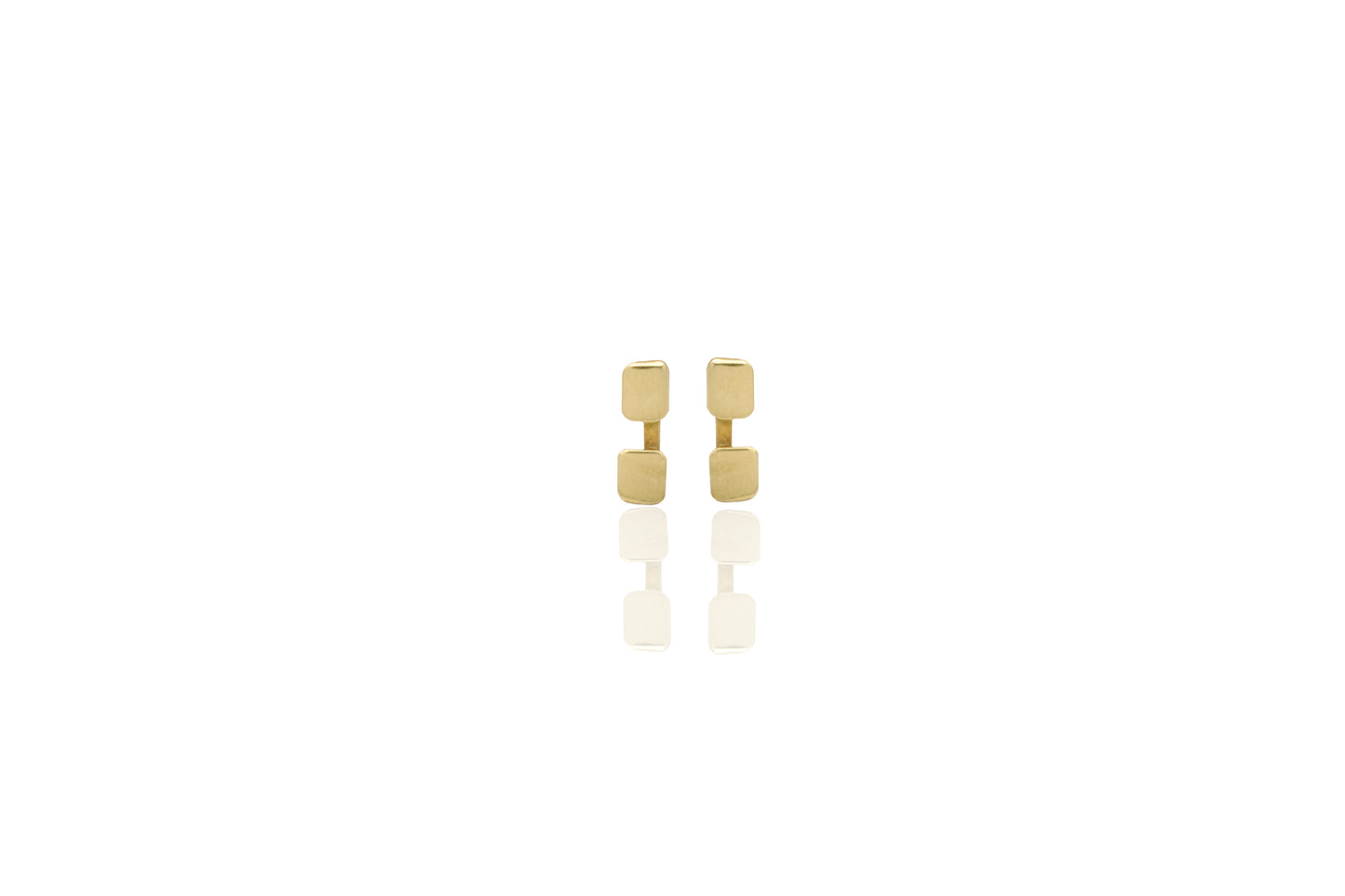 Gold square earrings on a white background