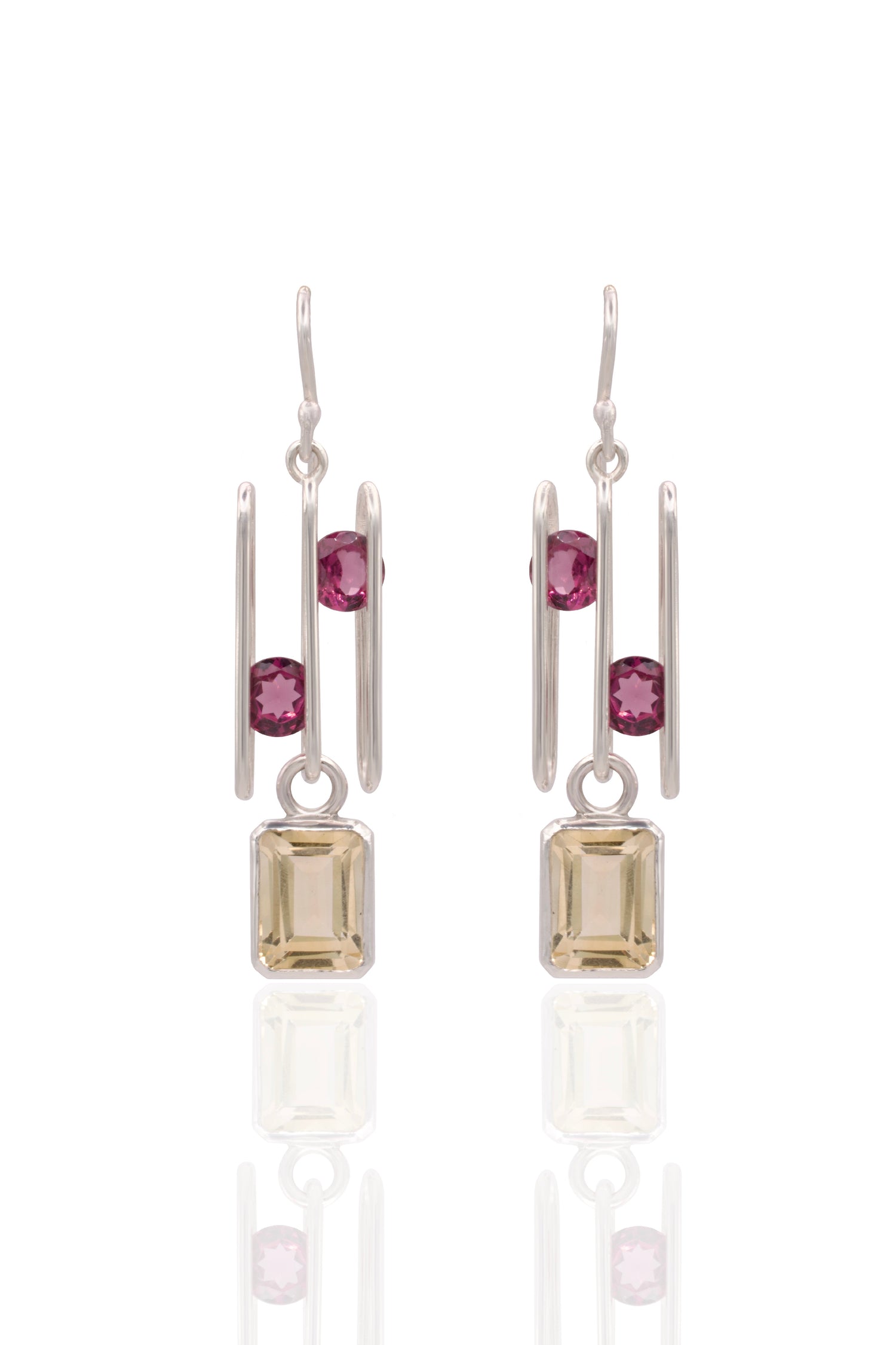Citrine and pink garnet earrings incased by sterling silver. 