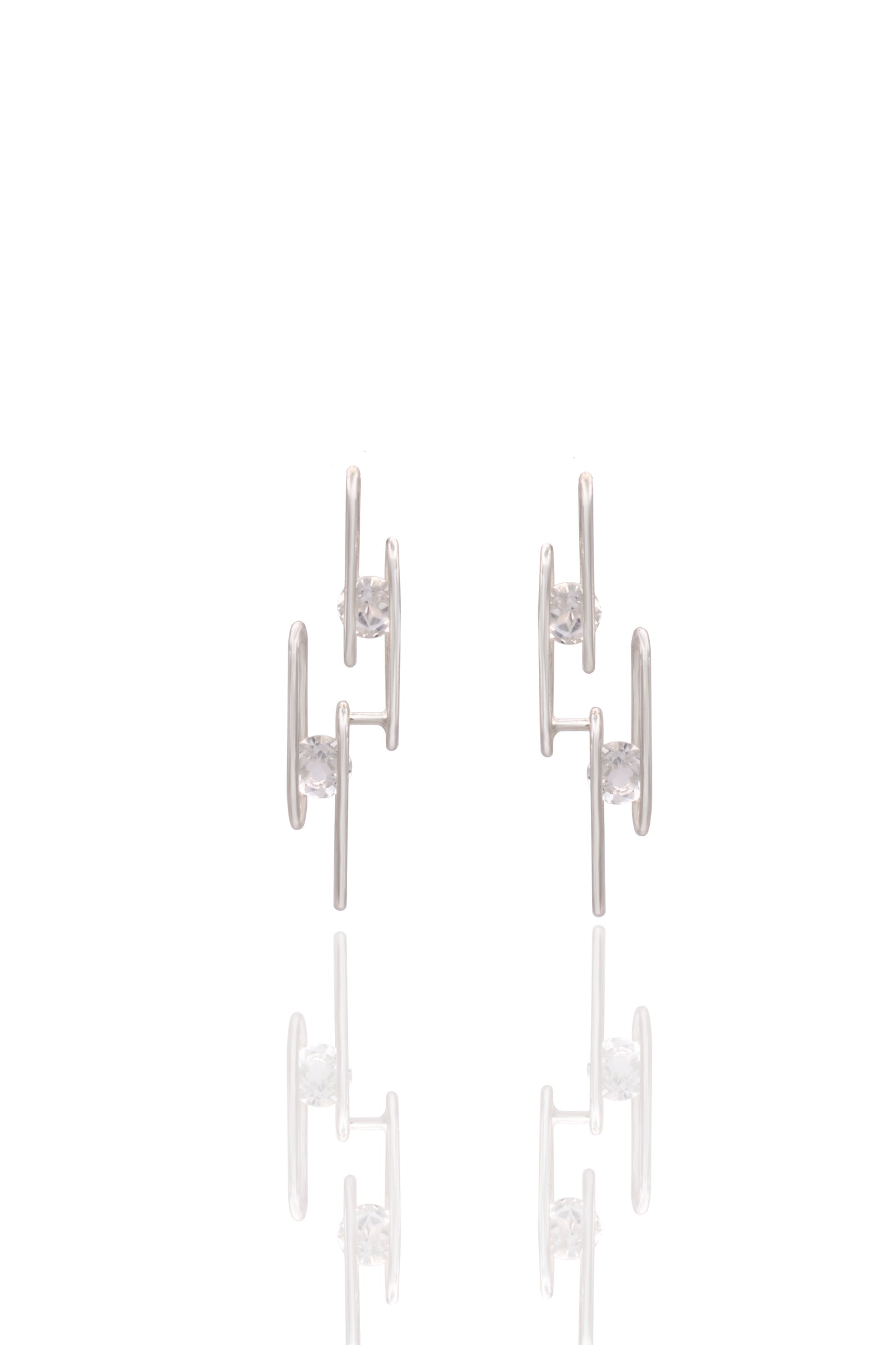 Pair of silver earrings on a white background