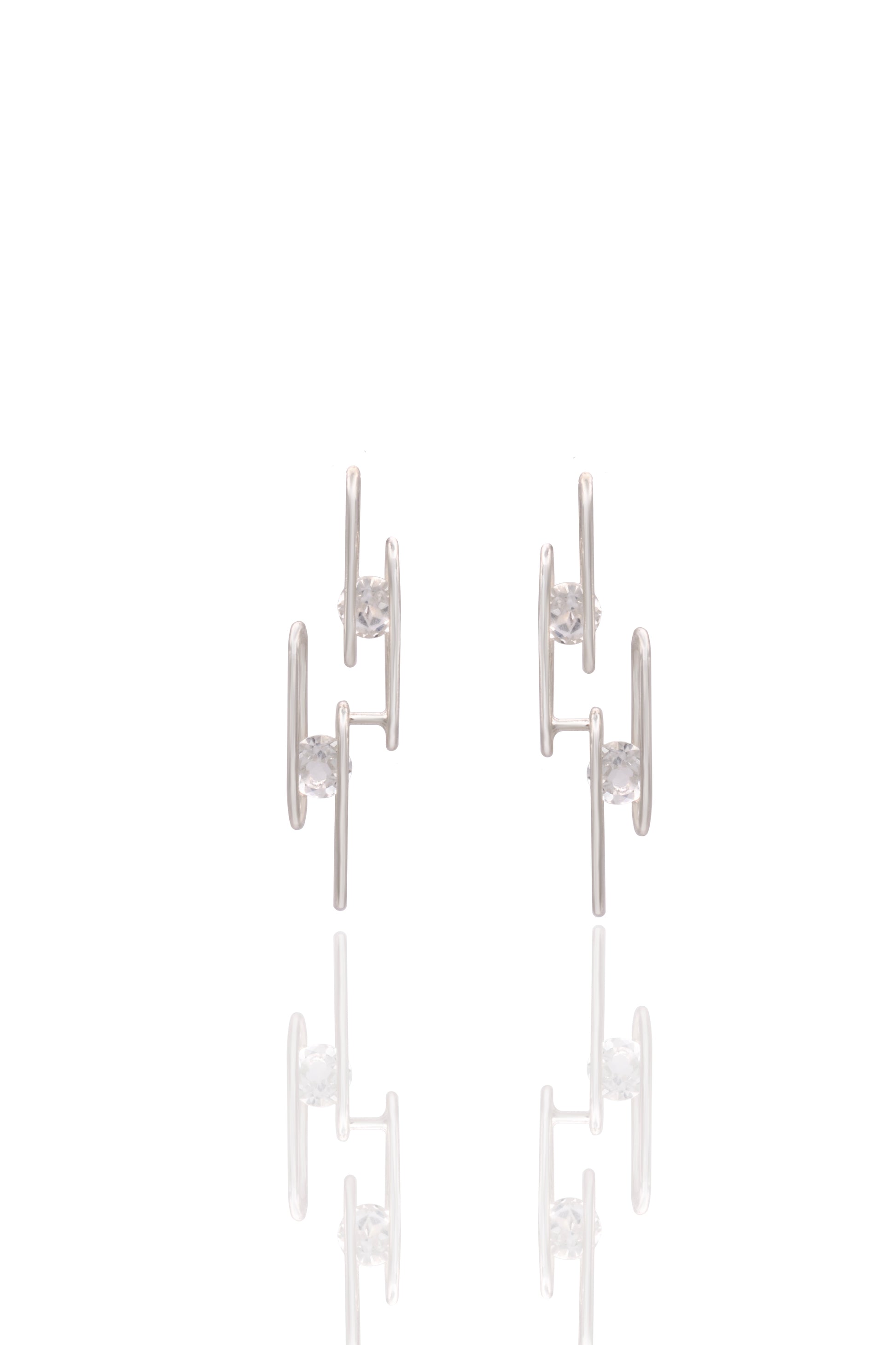 Pair of silver earrings on a white background