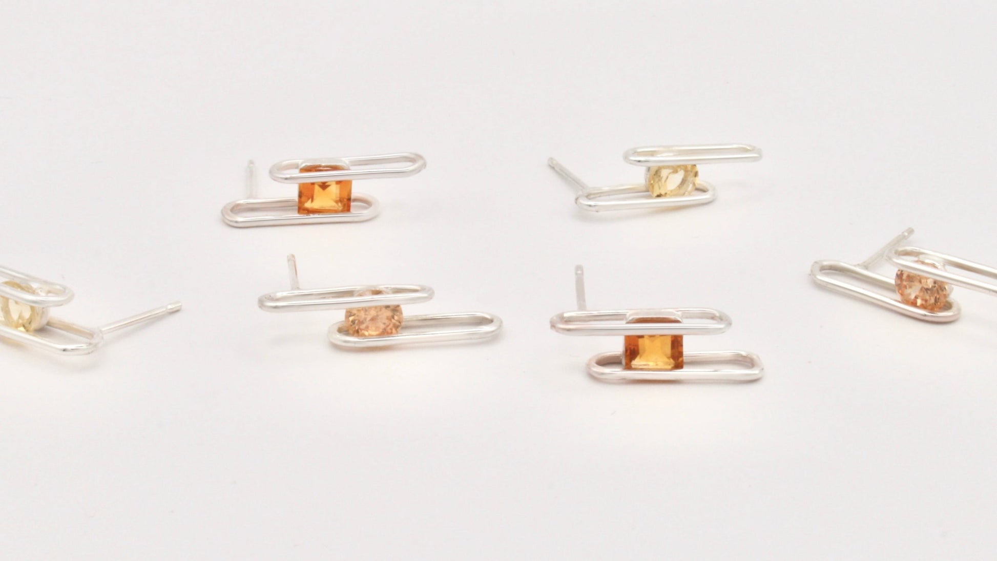 Gold and silver hair clips on a white background