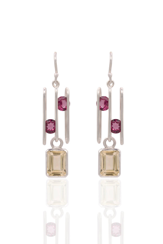 Pair of earrings with gemstones on a white background