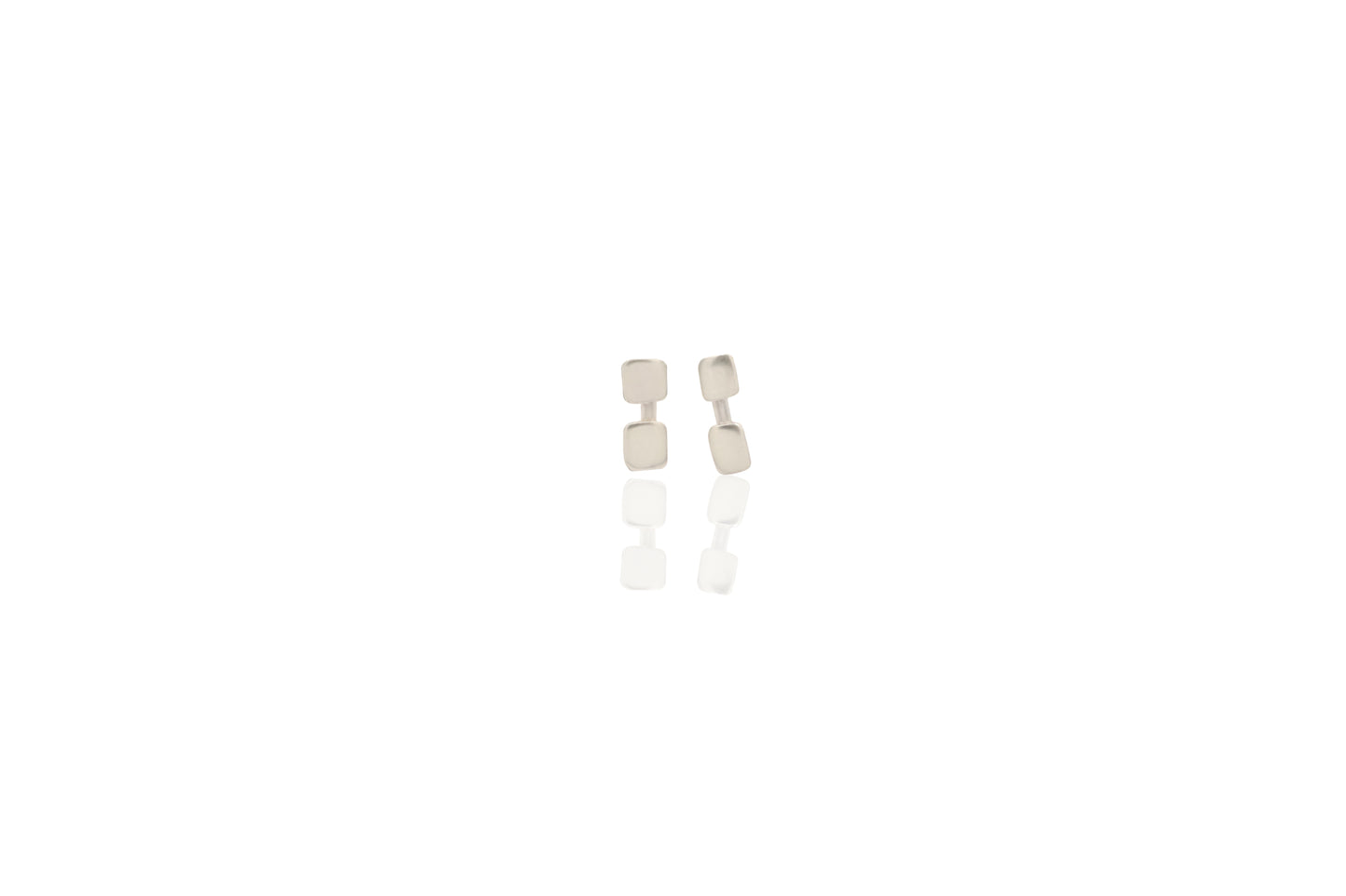 Pair of silver earrings on a white background