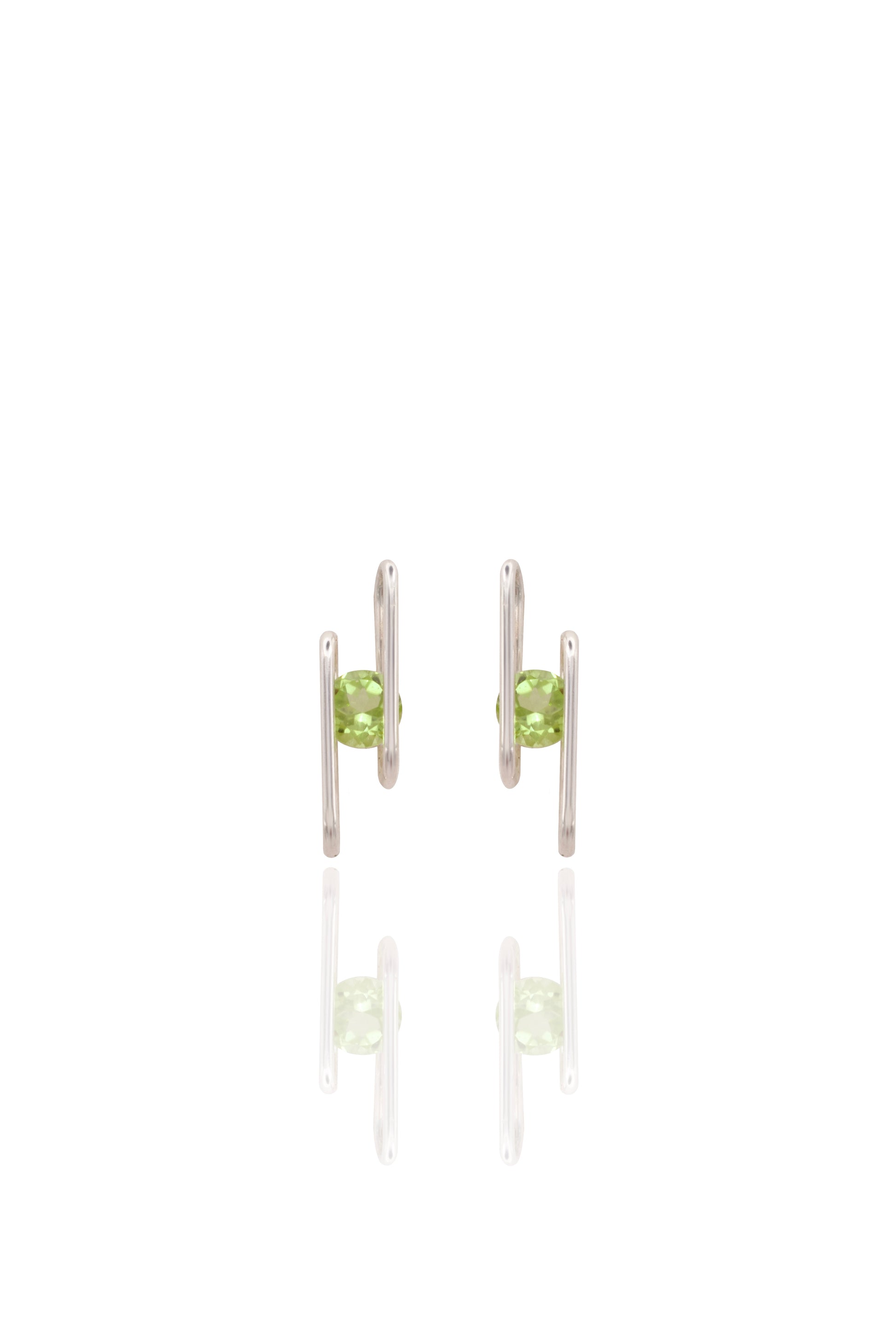 Pair of silver earrings with green gemstones on a white background